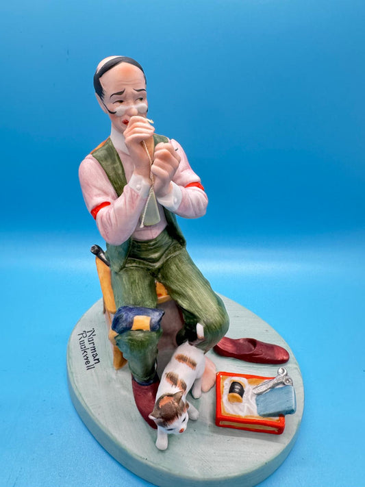 Norman Rockwell, se muestra se llama "Man Threading a Needle" (Hombre enhebrando una aguja)