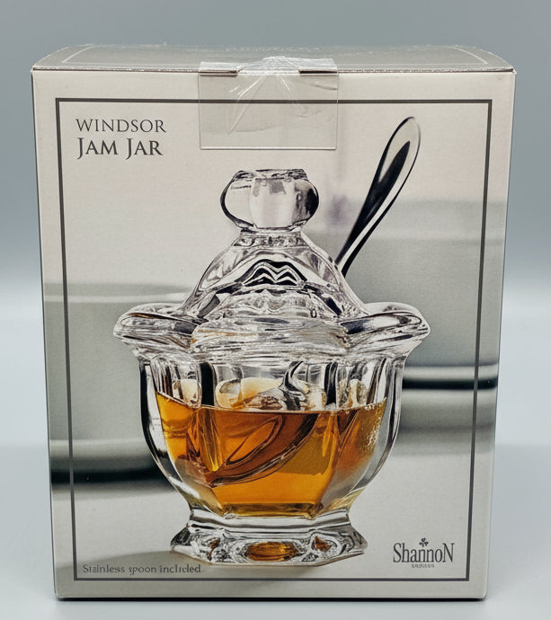 Frasco de cristal  con cucharita de acero inoxidable.