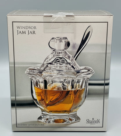 Frasco de cristal  con cucharita de acero inoxidable.