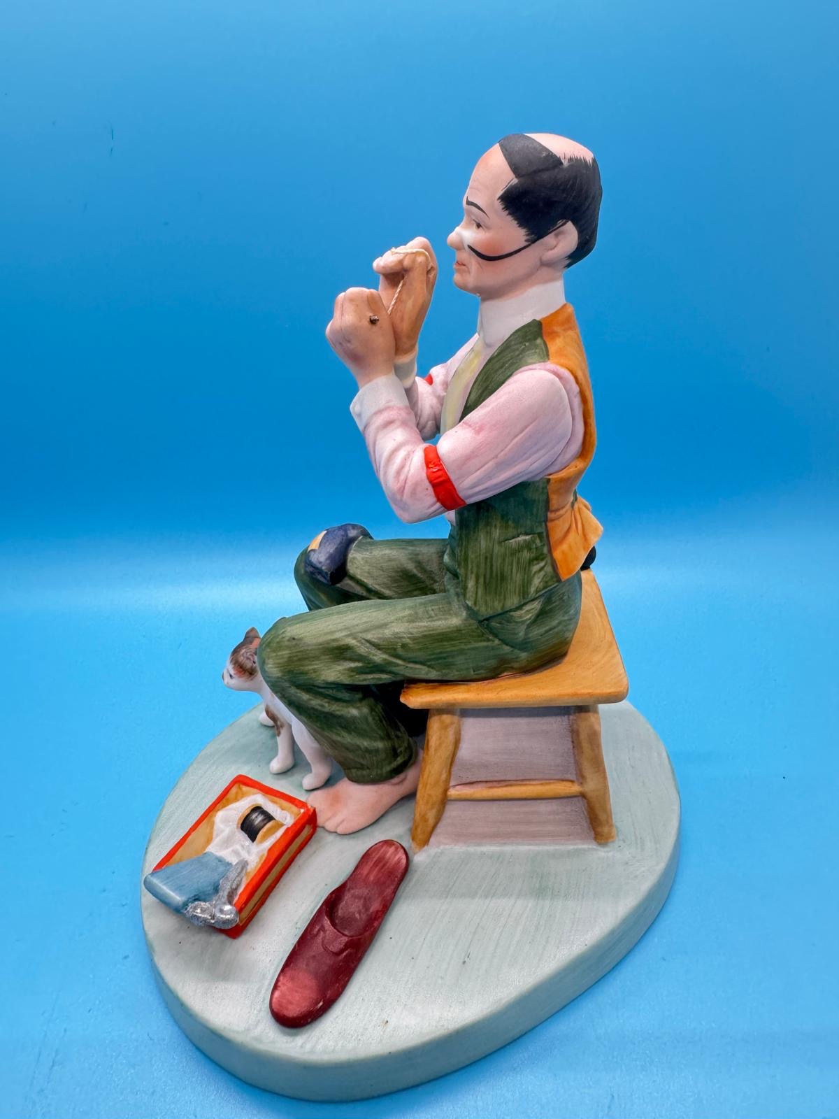 Norman Rockwell, se muestra se llama&nbsp;"Man Threading a Needle"&nbsp;(Hombre enhebrando una aguja)