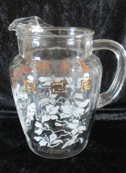 Jarra o Pichel Vintage Anchor Hocking MCM de vidrio transparente con detalles dorados, que ofrece durabilidad y resistencia para uso diario.