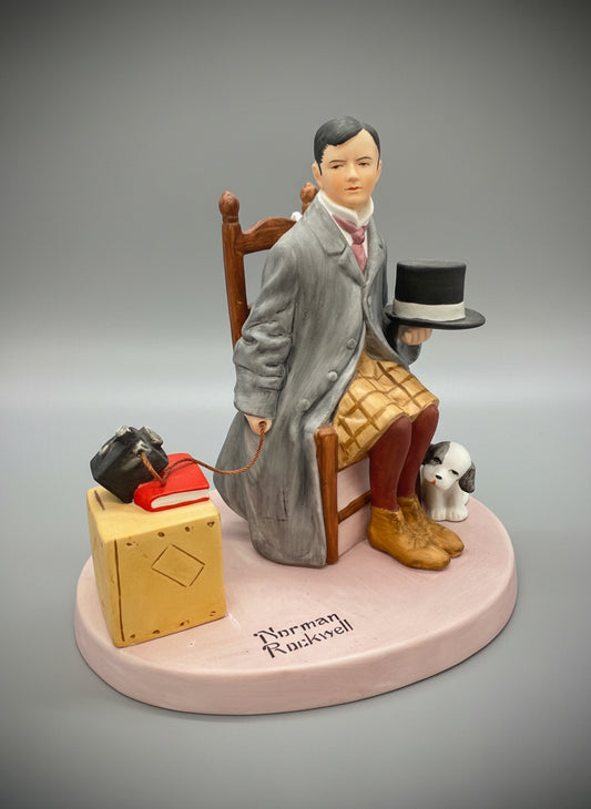 Norman Rockwell,  representa al propio artista sentado, sosteniendo un sombrero de copa y con un pequeño perro a sus pies, junto a una maleta donde se encuentran su cámara y un libro.