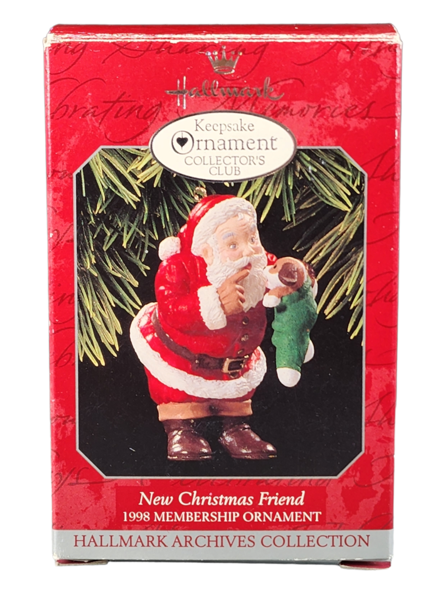 Adorno Hallmark Keepsake vintage que representa a Santa Claus con un cachorro nuevo.