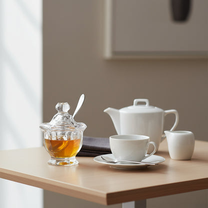 Frasco de cristal  con cucharita de acero inoxidable.